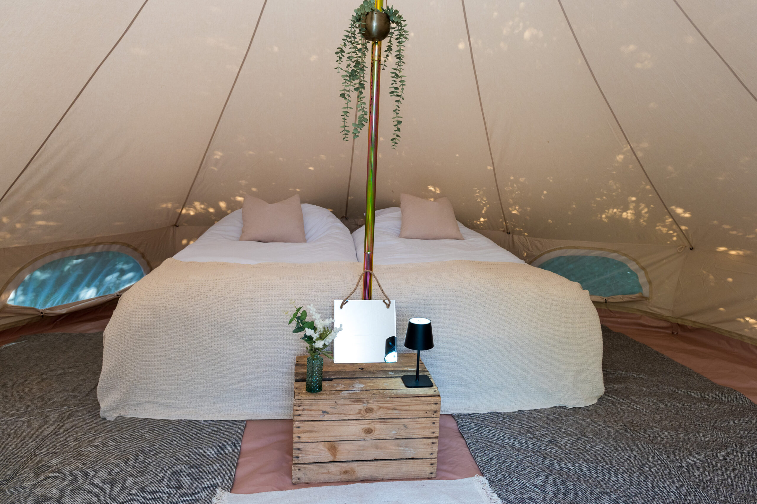 King-size bed setup inside a 5m bell tent