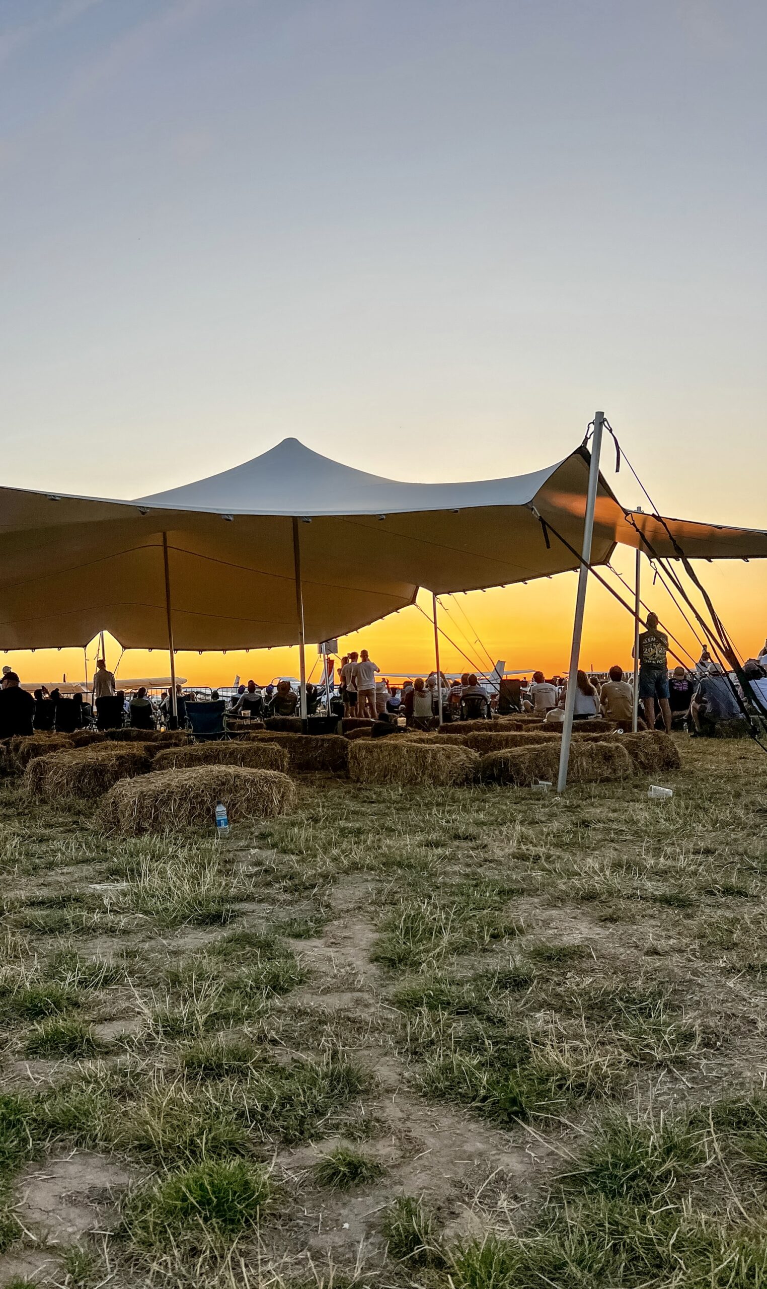 Stretch tent to hire for a festival with sunset