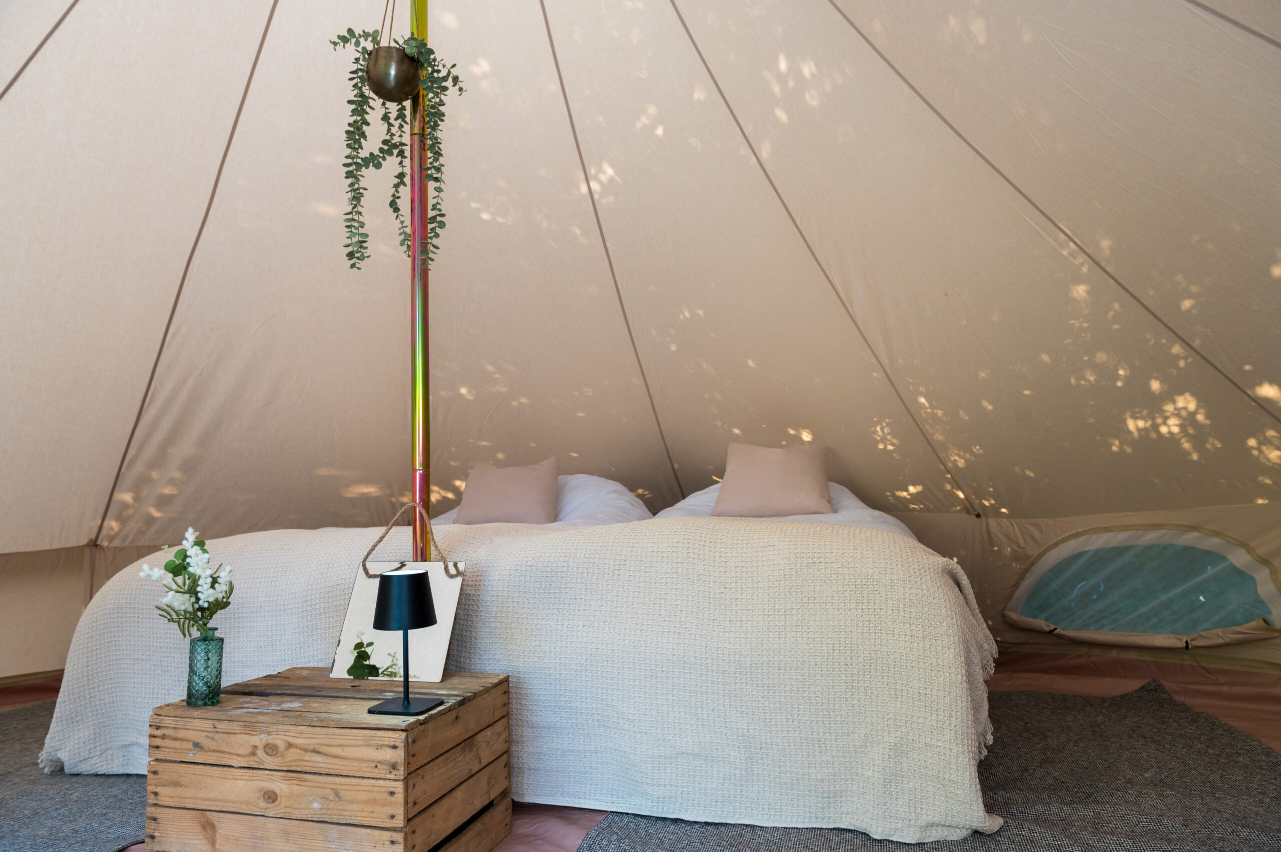 Luxury bell tent interior with double bed