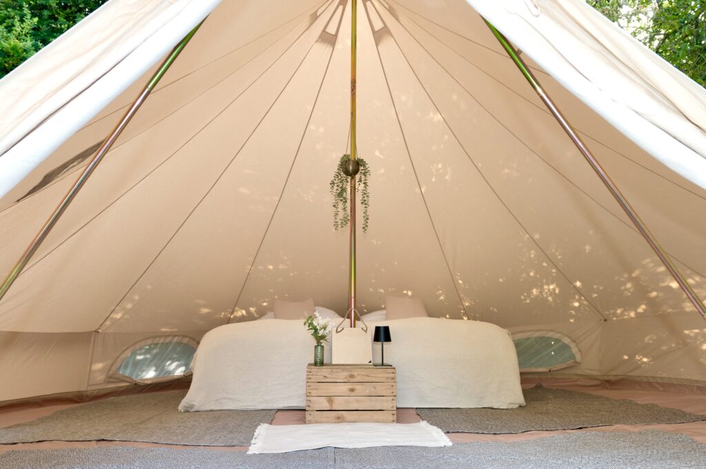 Festival bell tent hire interior with cosy beds